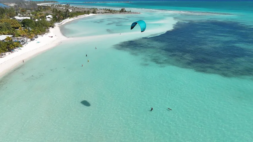 Sunny Beach Residences — Sunny Beach / Banana Bay · actual beach photograph with kitesurfer · project site in the background